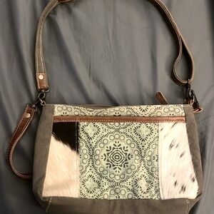 Myra Bag/crossbody. Two straps. Great condition. All zippers working.